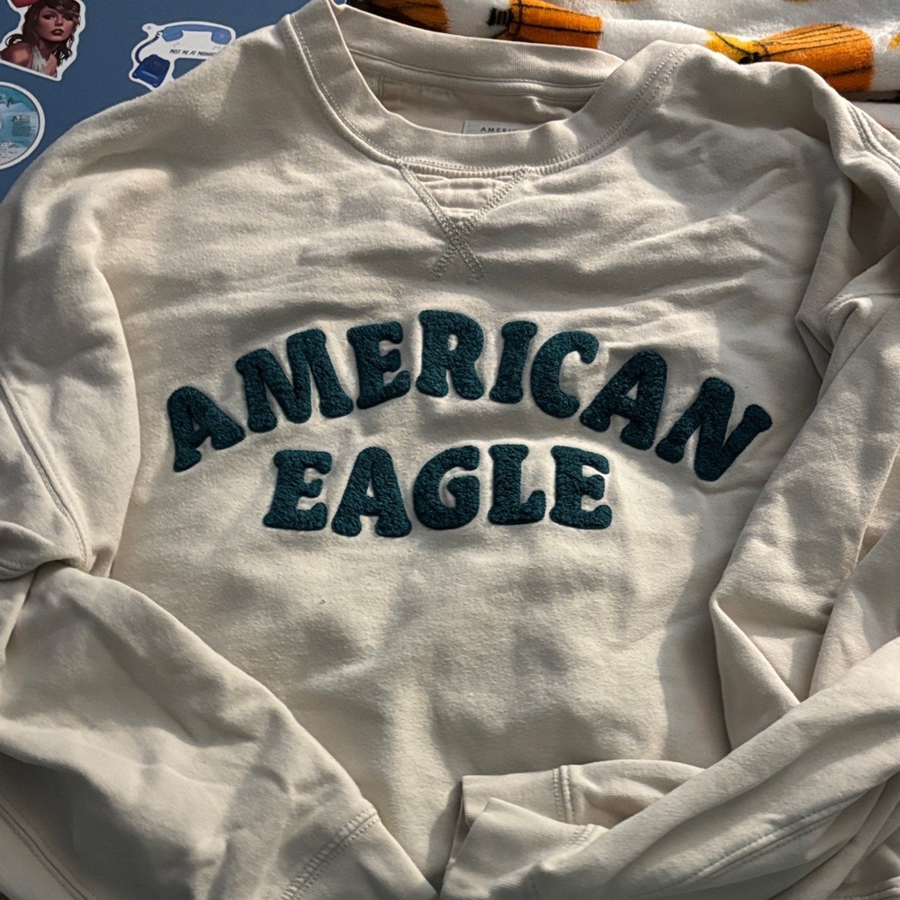 American Eagle Outfitters Cream V-Neck Sweater with Teal Text